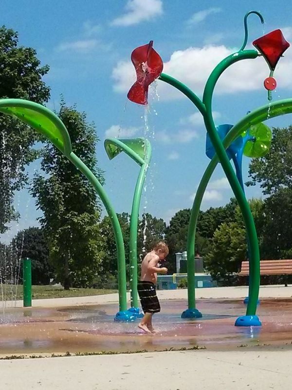 A boy playing in a splash pad