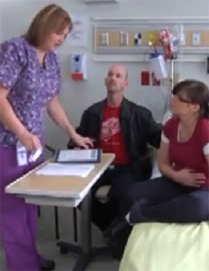 Mother and partner speaking with nurse