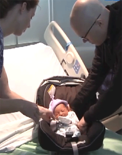 Father holding infant