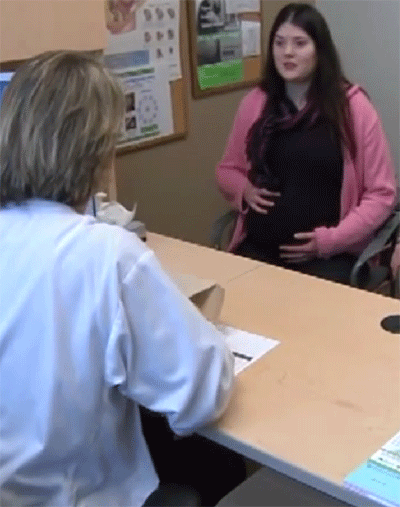 Mother speaking to nurse