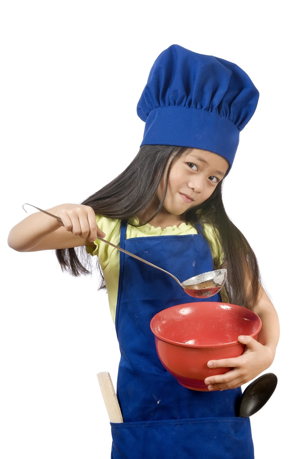 Young child cooking.