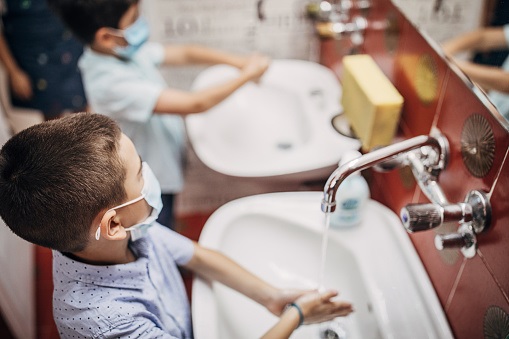 children washing their hands