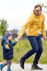 Father holding son's hand