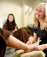 Woman giving a patient a pedicure