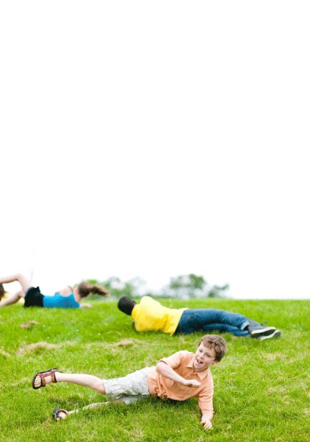 Child rolling down hill