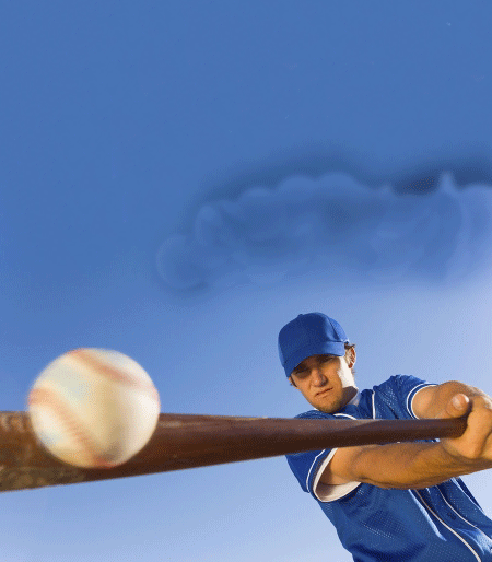 Man hitting baseball