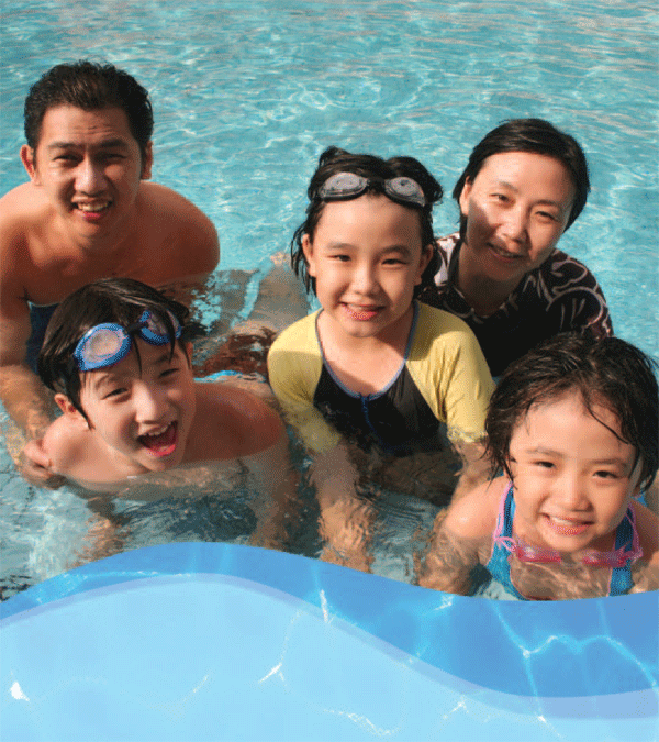 Family swimming in a pool