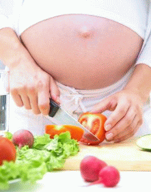 Pregnant woman cooking