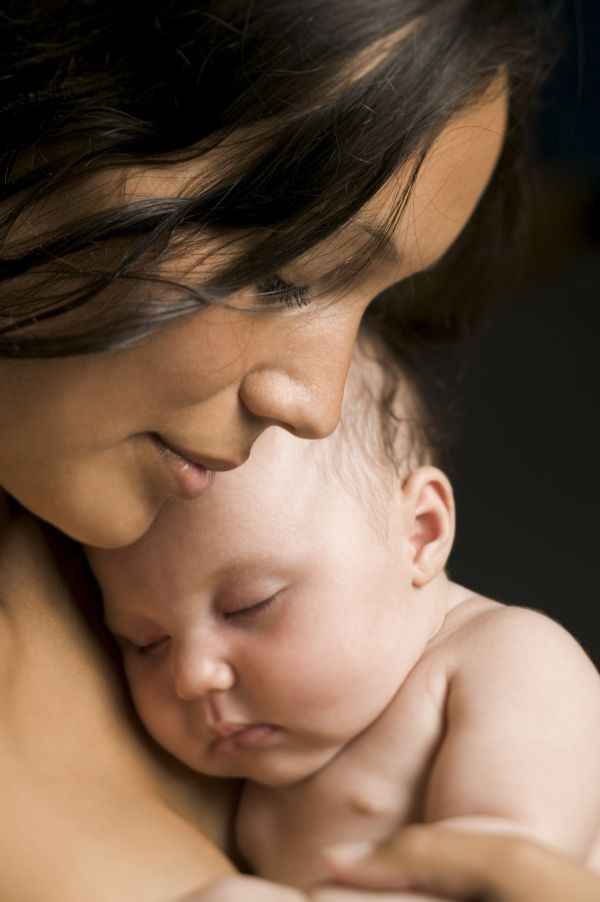 Mother holding baby skin-to-skin