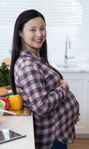 Pregnant woman cooking