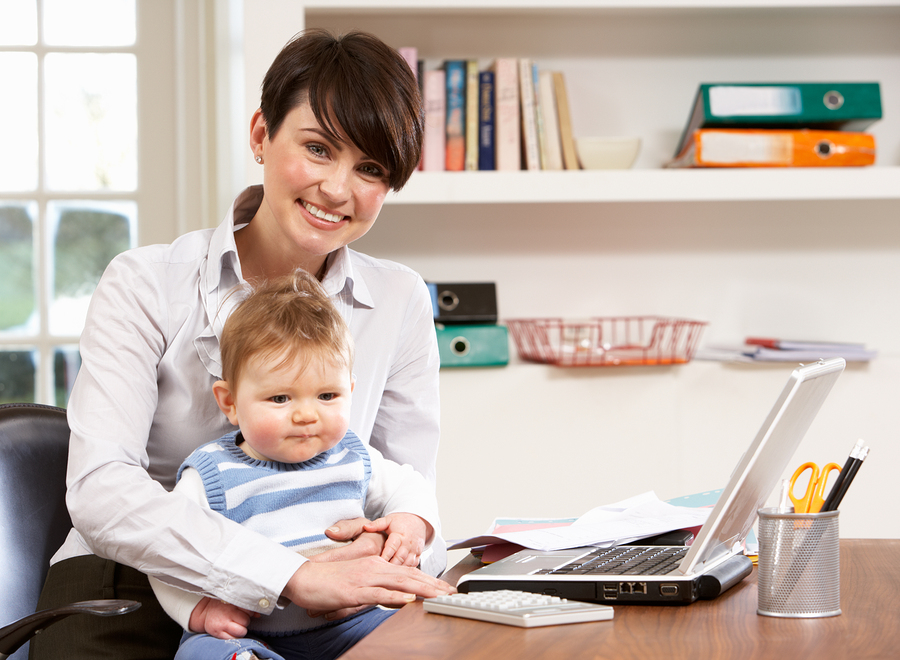 Woman with baby working from home