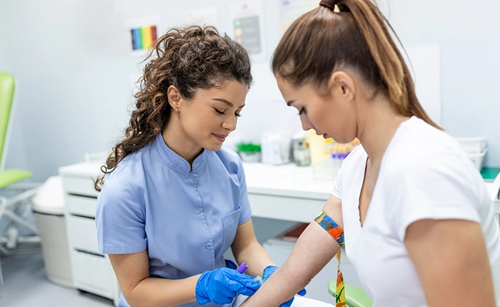 Healthcare provider working with patient on immunization